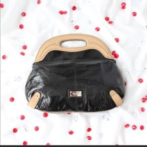 Nine West Black and Tan vegan leather purse.